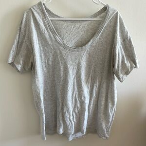 Grey t-shirt; intentional "distressed" look